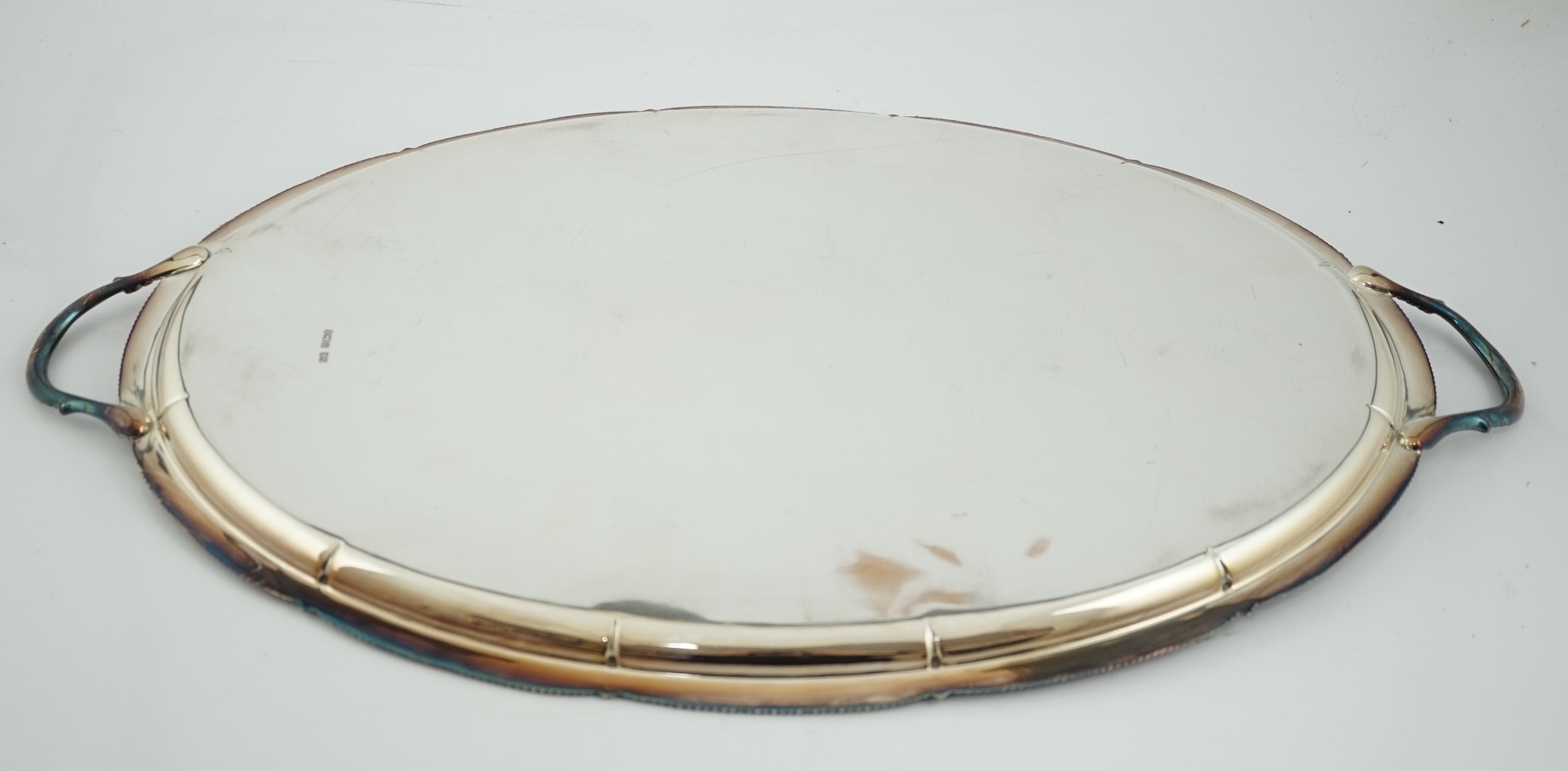 An Edwardian silver oval two handled tea tray, by George Howson